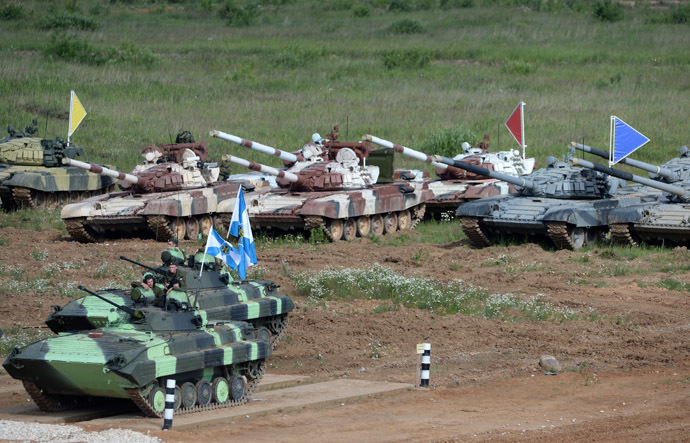 BMD-4M armored infantry fighting vehicles and T-72B tanks during Tank Biathlon 2014 competition held at the shooting range of the 2nd Guards Motor Rifle Tamanskaya Division in Alabino village. (RIA Novosti/Kirill Kallinikov)