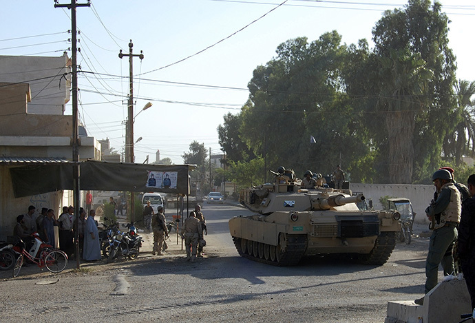 A tank from the Iraqi security forces patrols during an intensive security deployment on the outskirts of the city of Samarra, June 25, 2014. Iraqi troops were trying to advance on Tikrit from the direction of Samarra to the south that has become the military's line in the sand against a militant advance by the radical Sunni Islamic State in Iraq and the Levant (ISIL) group southwards towards Baghdad. (Reuters)