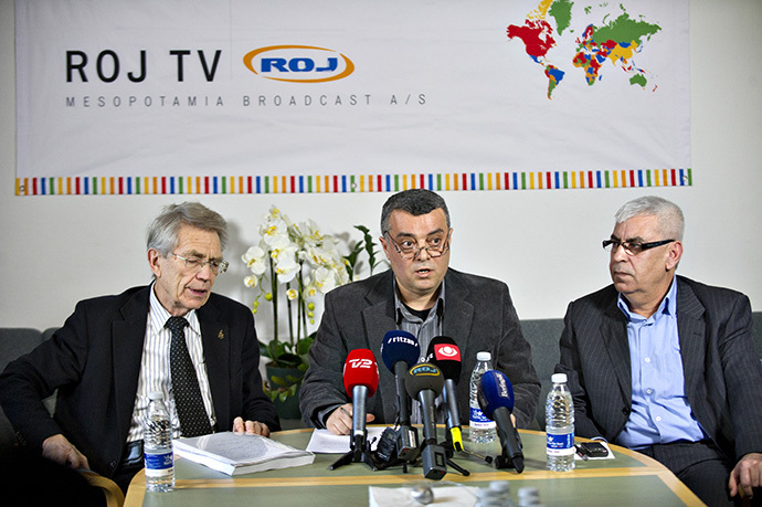 CEO of the Kurdish ROJ TV Imdat Yimmaz(C), flanked by defence attorney Bjorn Elmquist(L) and chairman of the board Jamil Bozo(R) (AFP Photo / Jens Noergaard Larsen)