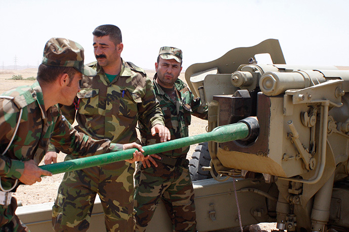 Kurdish Peshmerga troops prepare to fire a cannon during clashes with militants of the Islamic State in Iraq and the Levant (ISIL) in Jalawla, Diyala province June 29, 2014. (Reuters / Stringer)