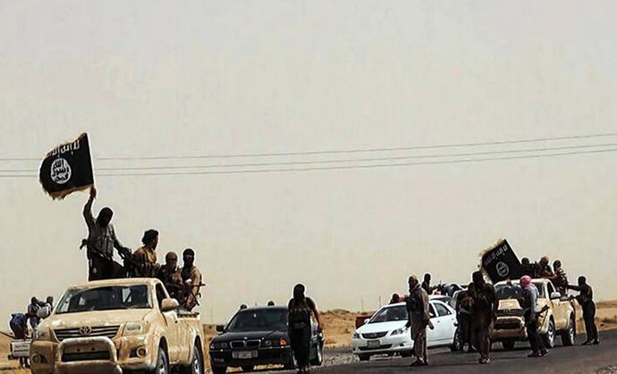 Militants of the Islamic State of Iraq and the Levant (ISIL) driving on a street at unknown location in the Salaheddin province. (AFP Photo / HO / Walayat Salahuddin)