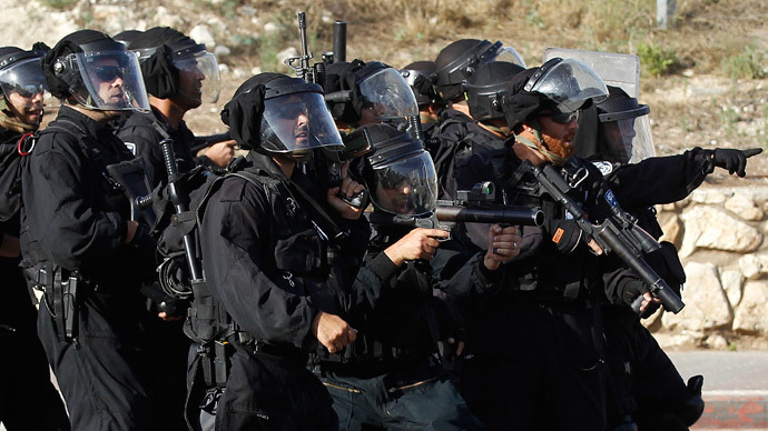 Israeli police take up positions in the Israeli-Arab town of Umm el-Fahm, during a demonstration by protesters against Israel's military operation to search for three missing Israeli teenagers in the occupied West Bank.(Reuters / Ammar Awad )