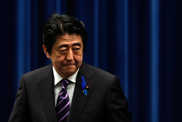 Japan's Prime Minister Shinzo Abe leaves a news conference at his official residence in Tokyo July 1, 2014 (Reuters / Yuya Shino)