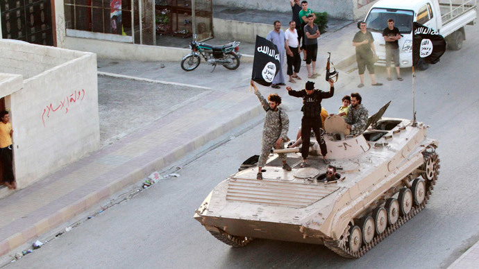 Militant Islamist fighters take part in a military parade along the streets of northern Raqqa province June 30, 2014.(Reuters / Stringer)