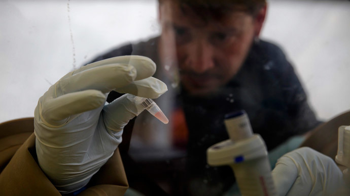 A scientist separates blood cells from plasma cells to isolate any Ebola RNA in order to test for the virus at the European Mobile Laboratory in Gueckedou.(Reuters / Misha Hussain)