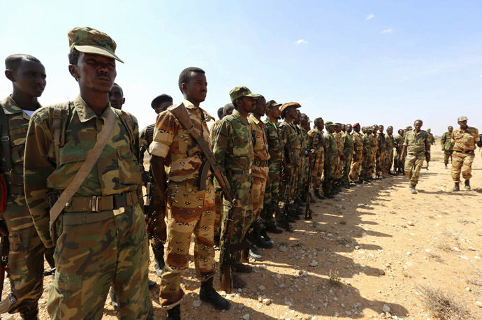 Ethiopian and Somali government soldiers line-up before embarking on a joint patrol in areas south east of Dusamareeb, March 19, 2014, as they prepare an offensive advance against al Shabaab militants, who have retreated into the central areas of Somalia. (Reuters/Feisal Omar)