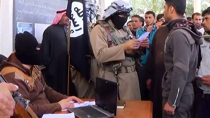 An image grab taken from a propaganda video released on March 17, 2014 by the Islamic State of Iraq and the Levant (ISIL)'s al-Furqan Media allegedly shows ISIL fighters recruiting volunteers at an undisclosed location in the Anbar province (AFP Photo)