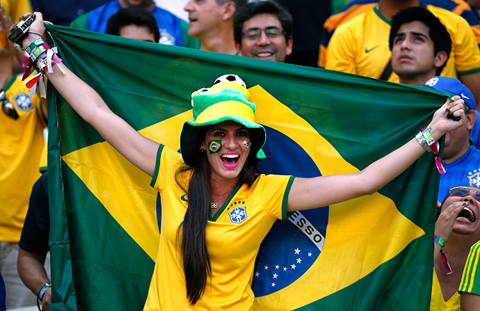 A Brazil fan cheers before the 2014 World Cup quarter-finals between Brazil and Colombia at the Castelao arena in Fortaleza July 4, 2014 (Reuters / Jorge Silva)