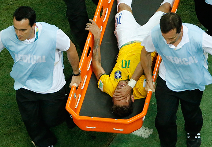 Brazil's Neymar grimaces in pain as he is carried off pitch on a stretcher during their 2014 World Cup quarter-finals against Colombia at the Castelao arena in Fortaleza July 4, 2014 (Reuters / Fabrizio Bensch)