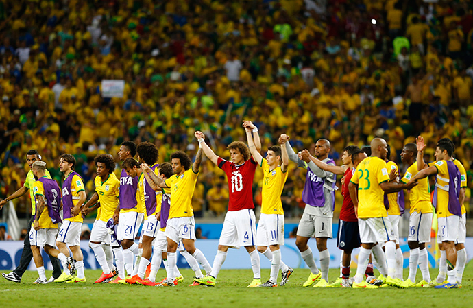 Brazil's national soccer players celebrate after the 2014 World Cup quarter-finals between Brazil and Colombia at the Castelao arena in Fortaleza July 4, 2014 (Reuters / Marcelo Del Pozo)