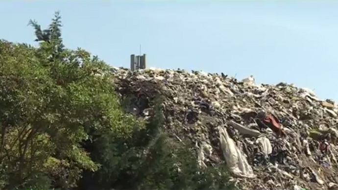What a waste! London suburb residents fume in face of 40ft rubbish mountain