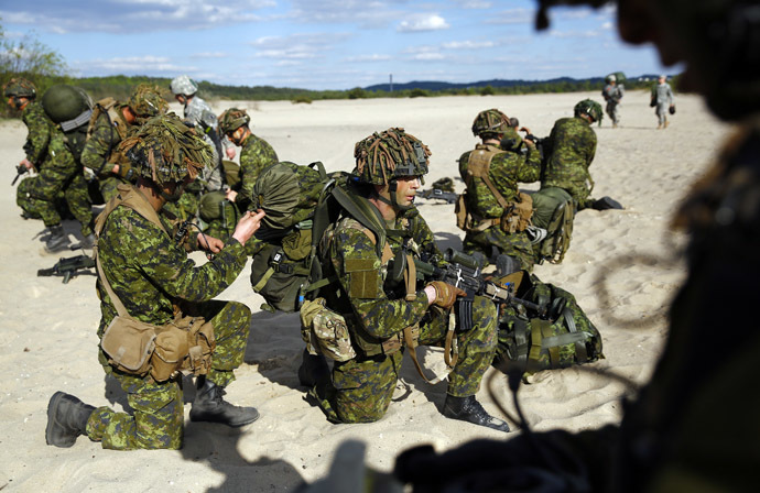 Troops from Canada's 3rd Division, composed with a platoon of 3rd Battalion and Princess Patricia's Light Infantry, participate at a NATO-led exercise "Orzel Alert" held together with the U.S. Army's 173rd Infantry Brigade Combat Team and Poland's 6th Airborne Brigade in Bledowska Desert in Chechlo, near Olkusz, south Poland May 5, 2014. (Reuters/Kacper Pempel)