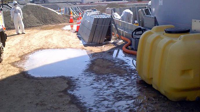 Leakage of radioactive water from a plastic tank (yellow) at TEPCO's Fukushima Dai-ichi nuclear power plant at Okuma in Fukushima prefecture. (AFP Photo / TEPCO)