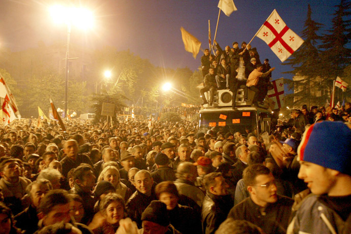 Georgian opposition supporters wave national flags as they celebrate outside the Georgian parliament in Tbilisi, November 22, 2003. (Reuters/Gleb Garanich)