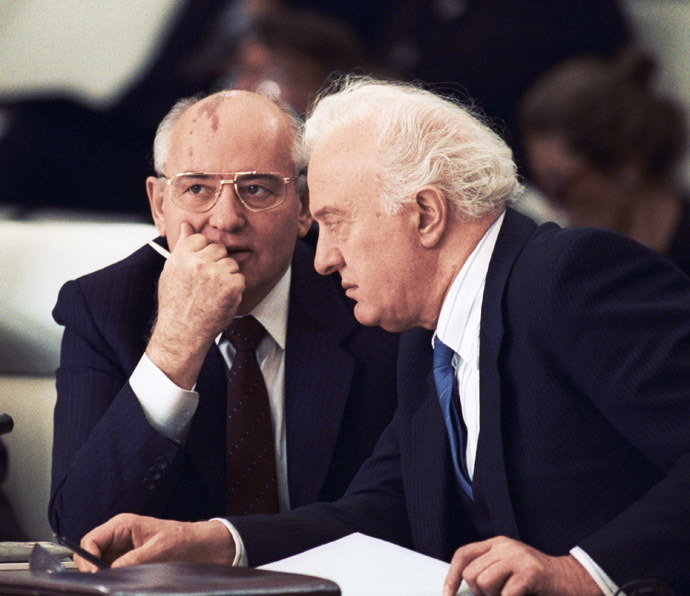November 21, 1990. U.S.S.R. President Mikhail Gorbachev (left) talking with U.S.S.R. Foreign Minister Eduard Shevardnadze (right) at the first plenary sitting of an all-European top-level meeting.