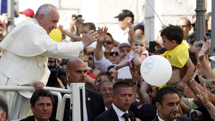 Pope Francis waves as he arrives to lead a prayer in Isernia, south of Italy, July 5, 2014. (Reuters/Ciro De Luca)