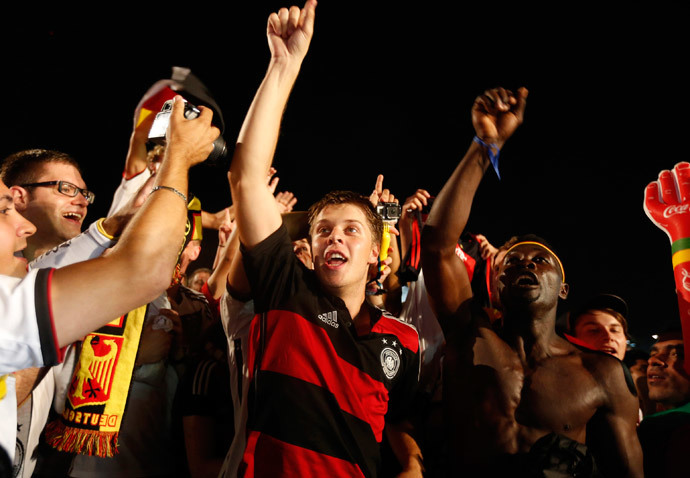 German soccer fans celebrate after watching a broadcast of the 2014 World Cup semi-final between Brazil and Germany at Copacabana beach in Rio de Janeiro, July 8, 2014.(Reuters / Pilar Olivares)