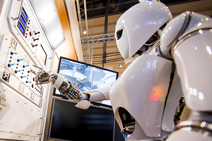 AILA, or Artificial Intelligence Lightweight Android, presses switches on a panel it recognizes during a demonstration at the German Research Center for Artificial Intelligence GmbH (AFP Photo / Carsten Koall)