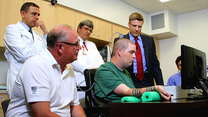 First time ever: Paralyzed man moves hand with thoughts using bionic tech (VIDEO)