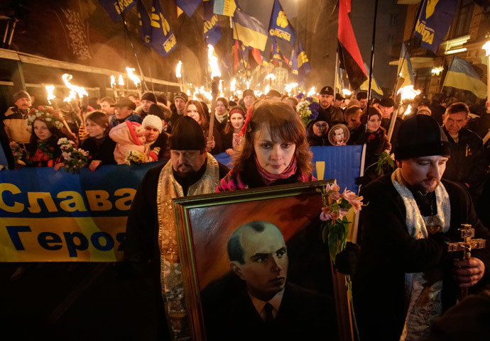 Activists of the Svoboda (Freedom) Ukrainian nationalist party hold torches as they take part in a rally to mark the 105th year since the birth of Stepan Bandera, one of the founders of the Organization of Ukrainian Nationalists (OUN), in Kiev January 1, 2014.(Reuters / Maxim Zmeyev)