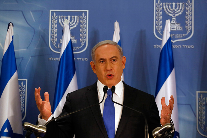 Israeli Prime Minister Benjamin Netanyahu gestures as he speaks during a press conference at the defense ministry in the Israeli coastal city of Tel Aviv on July 11, 2014. (AFP Photo / Gali Tibbon)