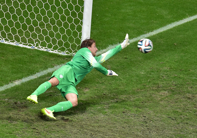 Netherlands' goalkeeper Tim Krul saves a penalty by Costa Rica's defender Michael Umana (not pictured) during the penalty shout out of a quarter-final football match between Netherlands and Costa Rica at the Fonte Nova Arena in Salvador during the 2014 FIFA World Cup on July 5, 2014. (AFP Photo/Gabriel Bouys)