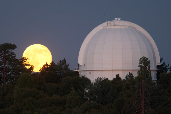 The so-called Supermoon, or perigee moon, rises behind the historic Mount Wilson Observatory on July 12, 2014 at Mount Wilson in the Angeles National Forest northeast of Los Angeles, California. (David McNew/Getty Images/AFP)