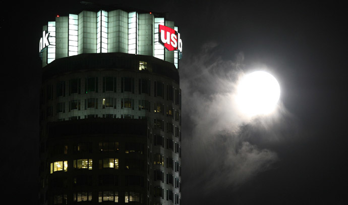 The so-called Supermoon, or perigee moon, rises behind a cloud near the landmark 73-story tall U.S. Bank Tower on July 12, 2014 in Los Angeles, California. (David McNew/Getty Images/AFP)
