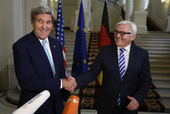 U.S. Secretary of State John Kerry (L) and German Foreign Minister Frank-Walter Steinmeier shake hands as they conclude remarks to the media, after talks between the foreign ministers of the six powers negotiating with Tehran on its nuclear program, in Vienna July 13, 2014. (Reuters/Jim Bourg)