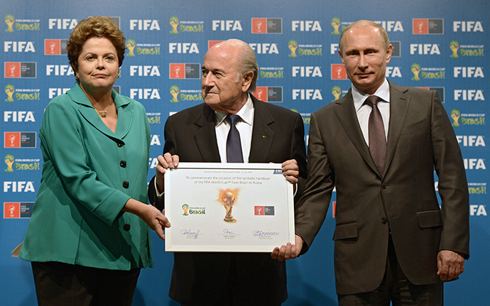 From right: Russian President Vladimir Putin, FIFA president Joseph Blatter and Brazilian President Dilma Rousseff during the official ceremony of handing over the 2018 World Cup signed certificate to Russia, July 13, 2014. (RIA Novosti / Aleksey Nikolskyi)