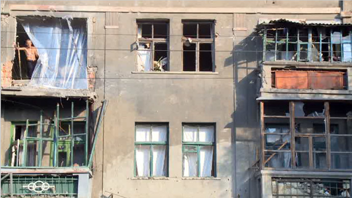Screenshot from RT video / House damaged by shelling in Lugansk, Eastern Ukraine