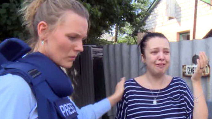 Screenshot from RT video / RTâs Maria Finoshina talks to a girl whose mother was wounded in shelling by Kievâs troops in Lugansk, Eastern Ukraine