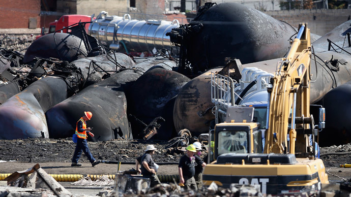 Emergency workers work on the site of the train wreck in Lac-Megantic, July 12, 2013. (Reuters / Mathieu Belanger)
