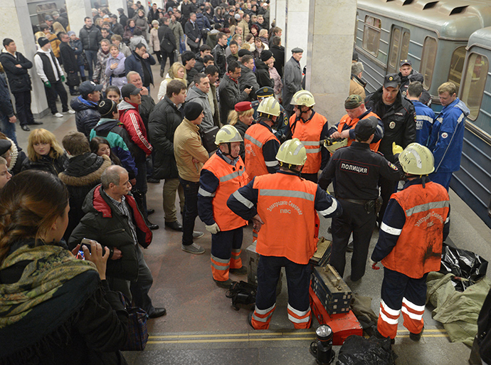 A rescue team on the platform of the Kuzminki metro station where a man fell on train tracks (Reuters / Evgeny Biyatov)