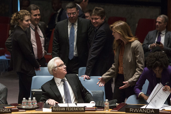 Samantha Power (R), the American ambassador to the United Nations talks to Russia's ambassador to the United Nations, Vitaly Churkin, before a vote regarding the Ukrainian crisis is taken at the U.N. Security Council in New York March 15, 2014. (Reuters/Andrew Kelly)