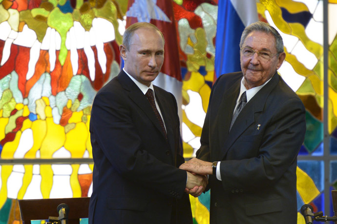 Russian President Vladimir Putin, left, and President of the Council of State and Ministers of the Republic of Cuba Raul Castro Ruz during a press statement at the Palace of the Revolution in Havana. (RIA Novosti/Aleksey Nikolsky)