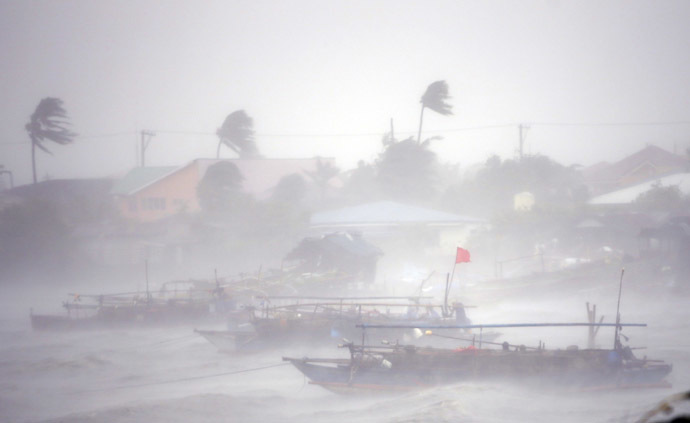 ishing boats are pictured amid heavy winds and rain brought by Typhoon Rammasun (locally named Glenda) as it hit the town of Imus, Cavite southwest of Manila, July 16, 2014. (Reuters) 