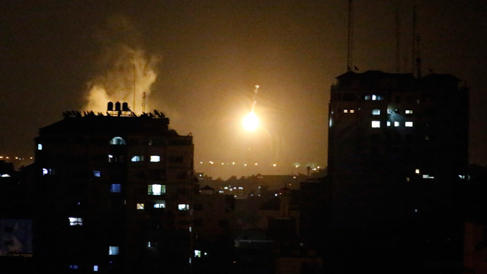 An Israeli missile hits Palestinian buildings in Gaza City on July 17, 2014.(AFP Photo / Thomas Coex )