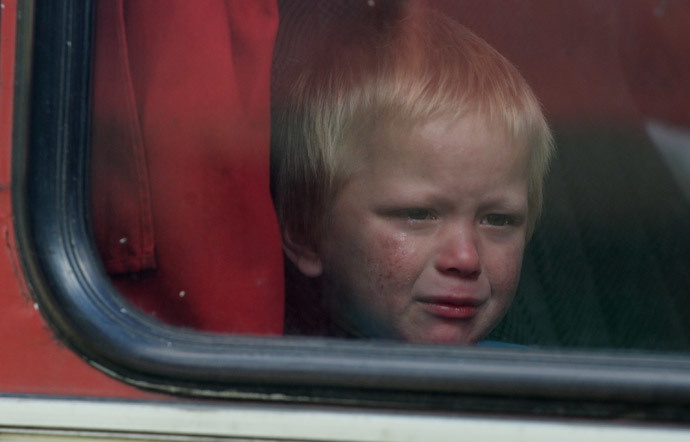 A boy in the bus with Donetsk Region refugees. (RIA Novosti / Mikhail Voskresenskiy) 
