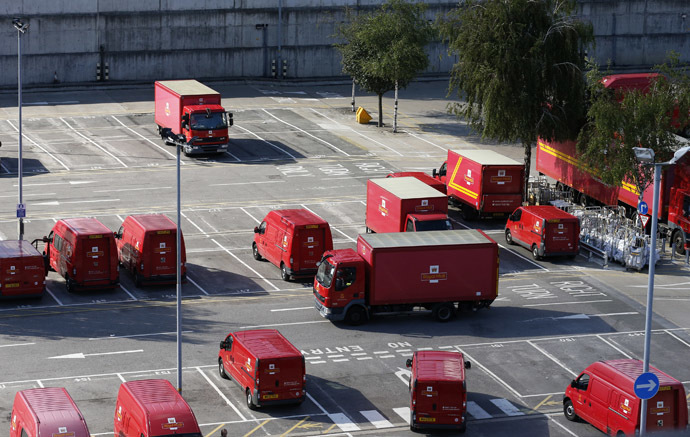 Postal vans wait to be taken out on collection rounds at Mount Pleasant sorting office in London (Reuters/Olivia Harris)