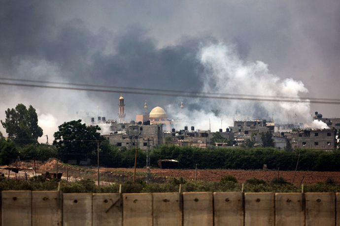 A picture taken from the southern Israeli Gaza border shows smoke billowing from the coastal Palestinian enclave during shelling by the Israeli army on July 22, 2014. (AFP Photo / Menahem Kahana)