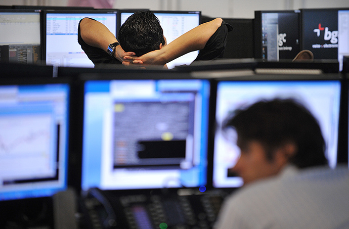 Brokers monitor market movements at the BGC Partners firm in London. (AFP Photo / Ben Stansall)