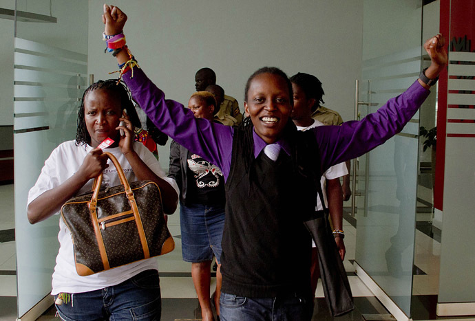 Members of Uganda's gay community and gay rights activists react as the constitutional court overturns anti-gay laws in Kampala on August 1, 2014. (AFP Photo)