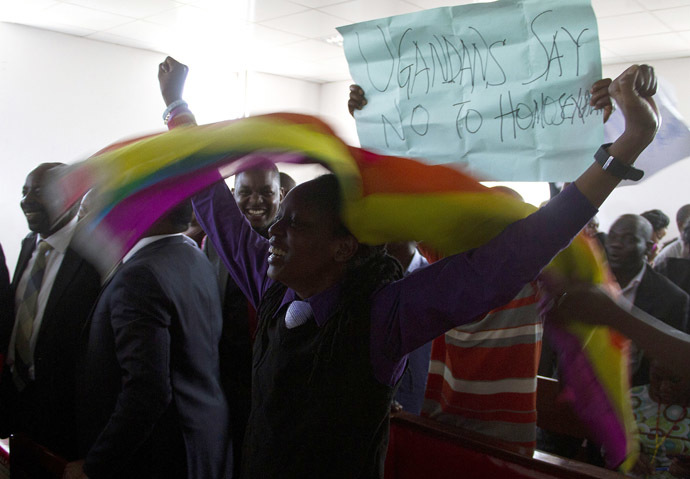 Members of Uganda's gay community and gay rights activists react as the constitutional court overturns anti-gay laws in Kampala on August 1, 2014. (AFP Photo)