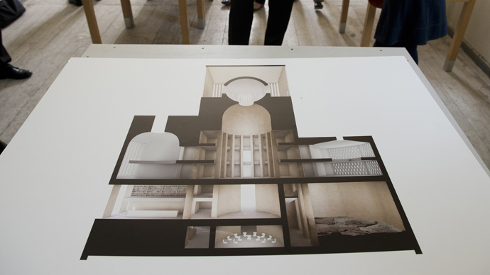 An illustration of German architect Wilfried Kuehn's design for the House of Prayer and Learning project, a multifaith prayer building, is on display during a presentation in Berlin (AFP Photo / John Macdougall)