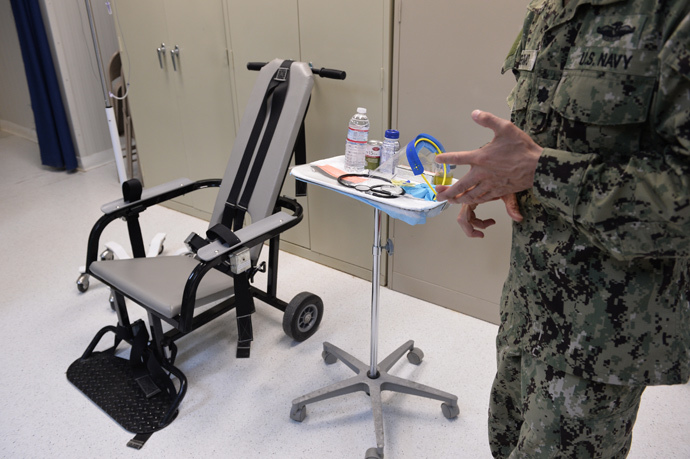 US naval medic explaining the "feeding chair" procedures at the detention facility in Guantanamo Bay, Cuba (AFP Photo / Mladen Antonov)