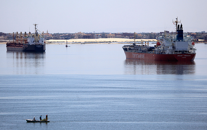 Cargo ships ply the Suez Canal (Reuters / Amr Abdallah Dalsh)