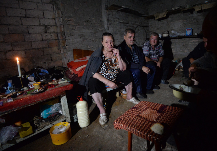 Residents of Shakhtyorsk in the basement of an apartment house during an artillery shelling by the Ukrainian army. (RIA Novosti / Mikhail Voskresenskiy) 