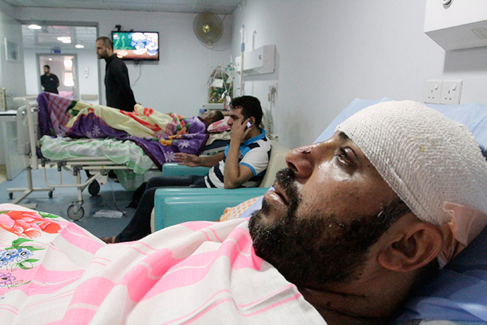 Shi'ite volunteers with the Iraqi Army, lie in hospital beds after being wounded in clashes with militants of the Islamic state, formerly known as the Islamic state in Iraqi and the Levant (ISIL), in Basra, southeast of Baghdad, August 6, 2014 (Reuters / Essam Al-Sudani)