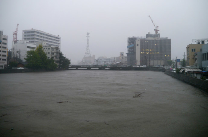 This picture shows the water levels of the Iwata River flowing in the central of Tsu in Mie prefecture as Typhoon Halong brings rain on August 9, 2014. (AFP Photo/Jiji Press)